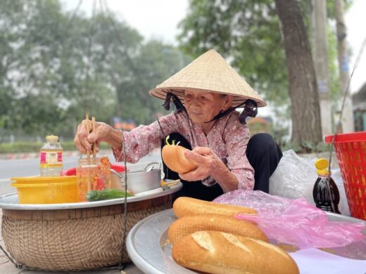 The old woman sells bread and meat for 0,2$ to the poor