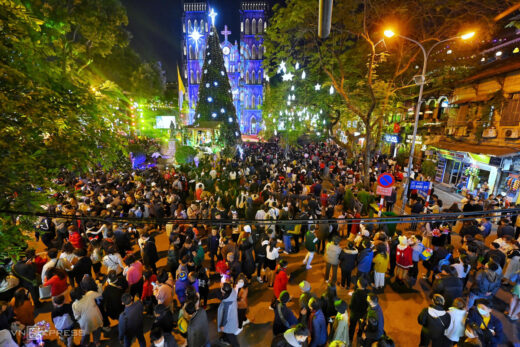 People in Hanoi and Ho Chi Minh City poured into the streets to celebrate Christmas